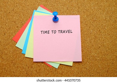 TIME TO TRAVEL Written On Color Sticker Notes Over Cork Board Background.              