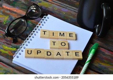 Time to update, text words typography on wooden background, life and business motivational inspirational concept