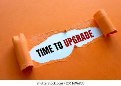 TIME TO UPGRADE written under torn paper. - Shutterstock ID 2061696983