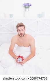 Its Time To Wake Up From Dream. Sexy Man Wake After Sleep. Handsome Guy Hold Clock In Bed. Wake Up To Alarm Clock Signal. Wakeup Service. Good Morning. Early Time. New Day