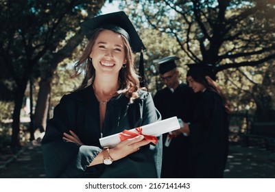 Its Time To Welcome An Exciting New Chapter. Shot Of A Student Holding Her Diploma On Graduation Day.