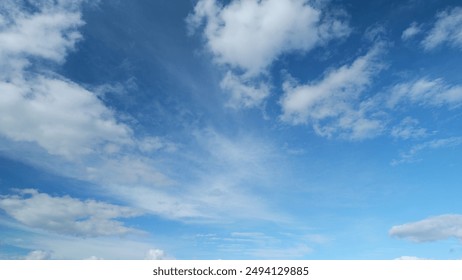 Timelapse. Floating fluffy clouds. Beautiful sunny blue sky with wispy smoky white cumulus and cirrus on different layers. - Powered by Shutterstock