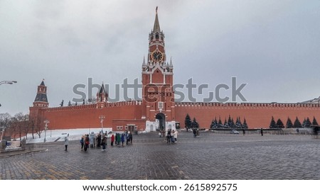 Timelapse hyperlapse showcasing The Saviour (Spasskaya) Tower and Kremlin walls of Moscow Kremlin, Russia during the daytime in winter. This view is from Red Square.