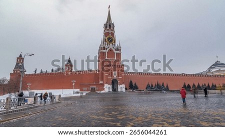 Timelapse hyperlapse showcasing The Saviour (Spasskaya) Tower and Kremlin walls of Moscow Kremlin, Russia during the daytime in winter. This view is from Red Square.