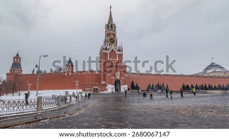 Timelapse hyperlapse showcasing The Saviour (Spasskaya) Tower and Kremlin walls of Moscow Kremlin, Russia during the daytime in winter. This view is from Red Square.