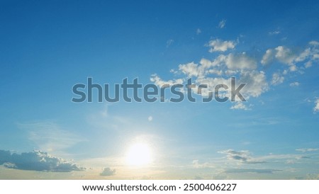 Timelapse. Panoramic view. Sunset sky with condensation trail. Dramatic warm near and far clouds at sunset.