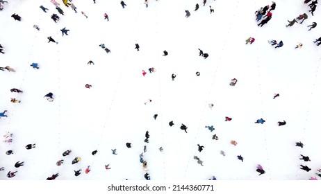 Timelapse People Skating on an Open-Air Ice Skating Rink. Top view. Many People Skating on Ice of Rink. Fast Moving. Aerial Drone View. Beautiful Skating Sport and Winter Outdoor Activities Background