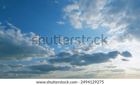 Timelapse. Rays of sun through clouds. Blue sky with cloudscape backlit bright sunlight through summer.