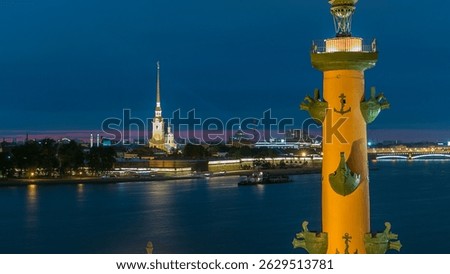 Timelapse showcasing the front view of the iconic Rostral Column, Peter and Paul Cathedral, and the Neva River main attractions of Saint-Petersburg. Captured from a rooftop. Saint-Petersburg, Russia
