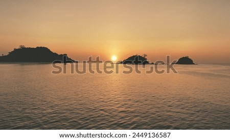 Timelapse of sunset seascape at mountain island silhouette aerial. Nobody nature landscape of Philippines, El Nido Isle, Visayas Archipelago. Waves at ocean bay. Sea waves at summer evening