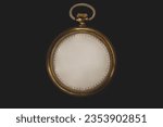 Timeless concept. Antique clock without numbers and hands, isolated on black background. Photomanipulation.