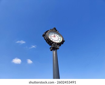 Timeless Elegance: The Clock Tower, Standing Tall Under the Blue Sky, Represents Community, Heritage, and the Unstoppable Passage of Time.