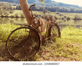 Timeless Journey: Vintage Bicycle Overlooking the Mosel River and Vineyards - Powered by Shutterstock