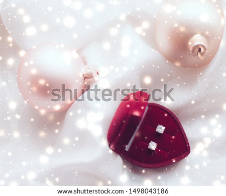 Timeless luxury, romantic proposal and happy celebration concept - Diamond earrings in a heart shaped jewellery gift box, love present for Christmas, New Years Eve, Valentines Day and winter holidays