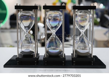 The timepieces are all different sizes and are all set to the same time. The display is on a white table