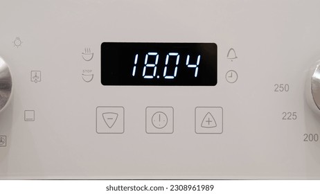 Timer clock on the kitchen oven. Cooking time, timelapse
