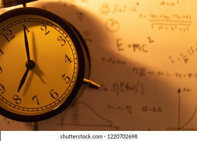 Times clock with Math equations background vintage color tone.