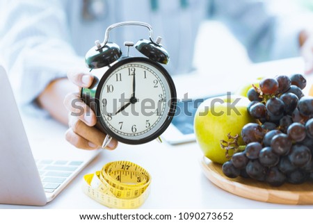 Times to Healthcare or Diet Food advisor show clock for timing care your health with healthy food and concept.
