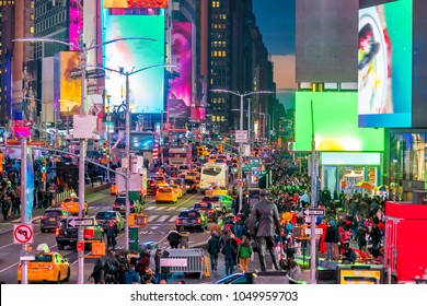 Times Square with neon art and commerce, an iconic street of Manhattan in New York City , United States  - Shutterstock ID 1049959703
