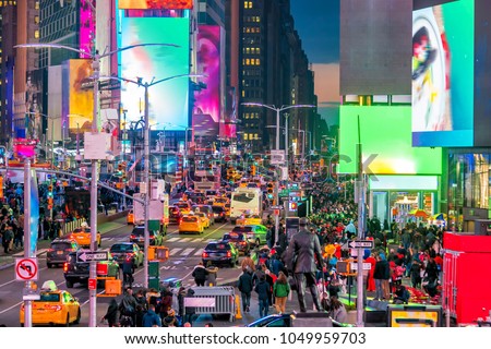Times Square with neon art and commerce, an iconic street of Manhattan in New York City , United States 