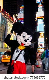 Times Square, New York City, New York - Circa 2014 - Disney Mickey Mouse Character In Costume With I Love New York Tee Shirt And Waving In Times Square At Night New York City