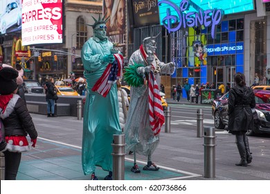 Times Square, New York - January 2017: A Daytime View Of The Times Square Street With Street Artists Dressed Up As Fictional Characters And Statue Of Liberty