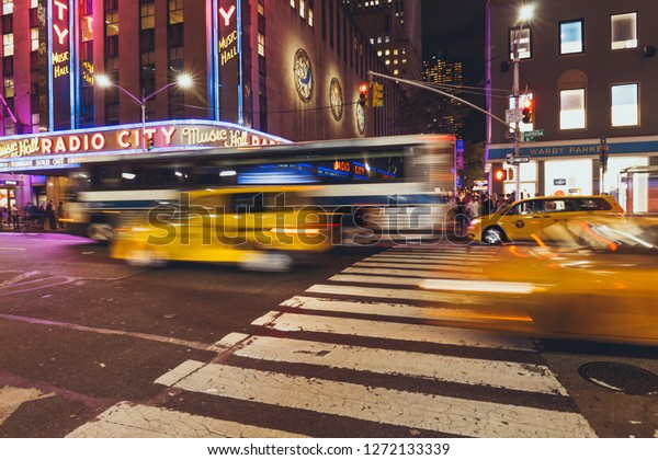 TIMES SQUARE,\
NEW YORK, USA - OCTOBER 8, 2018: motion picture of times square and\
cars in new york at night,\
usa