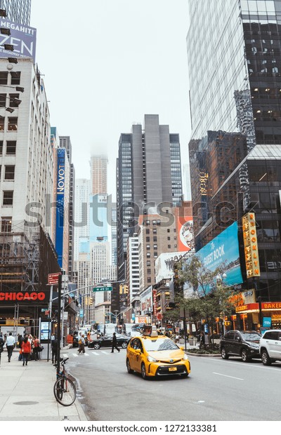 TIMES SQUARE, NEW YORK, USA\
- OCTOBER 8, 2018: urban scene with crowded times square in new\
york, usa