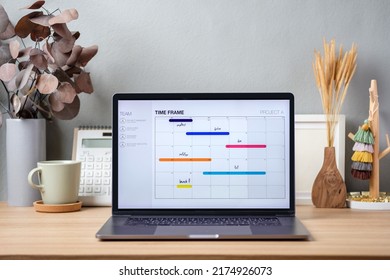 Timetable Project On Screen Laptop On Working Desk Decor With Stationery At Home