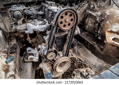 Timing Belt With Rollers Installed On The Old Rusty Car Engine