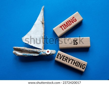 Timing is Everything symbol. Wooden blocks with words Timing is Everything. Beautiful blue background with boat. Business and Timing is Everything concept. Copy space.