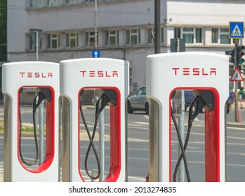 Timisoara, Romania - 06.19.2021: Tesla Supercharger stall station with parking space and cable-outlets