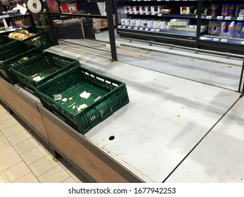 TIMISOARA, ROMANIA - MARCH 10, 2020: Empty Crates In The Produce Section Of A Supermarket Due To The Coronavirus Epidemic Panic Buying. 