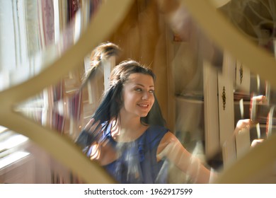 TIMISOARA, ROMANIA - October 29, 2013: Distorted Portrait Of A Brunette Woman. View Through A Glass Window 