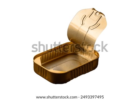 Tin or aluminum opened rectangular can of canned food with a key on a dark concrete background