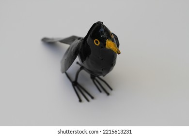 Tin Blackbird Made Of Metal And Painted In A Black And Yellow Lacquer 