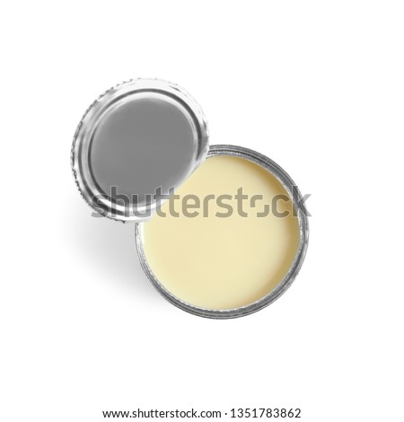 Tin can with condensed milk on white background, top view. Dairy product