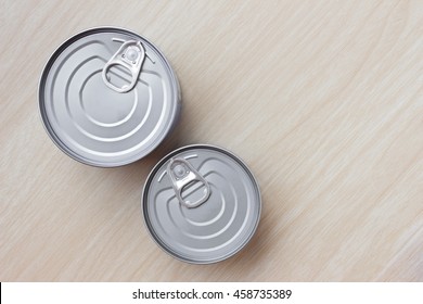 Tin Can On Wood Table / Top View. Canned Tuna Isolated On Wood Background