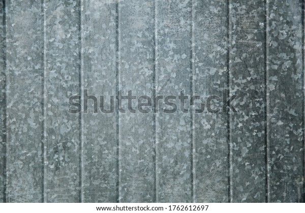 Tin fence with a beautiful\
textured pattern. Graffiti Place. Modern fence with vertical\
stripes.