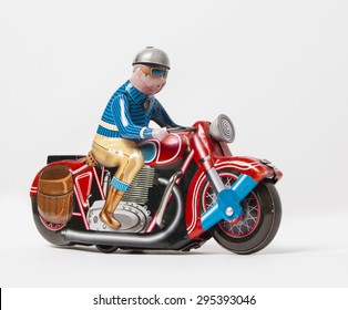 Tin Motorcycle Clockwork Toy On White