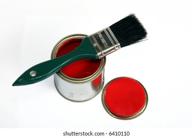 Tin Of Red Paint With Lid And Brush With Green Handle On White Background