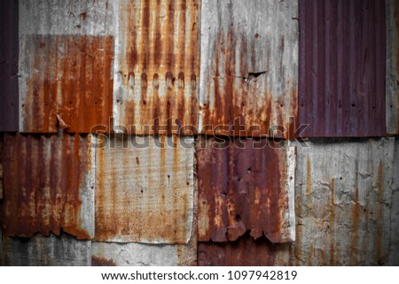 The tin roof background with the rust and nails hole by vintage style.