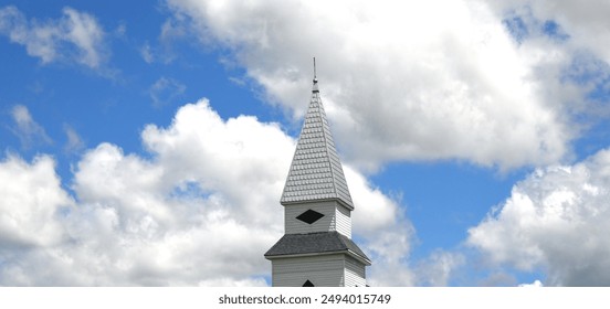 Tin roofed steeple, of the Lebanon Cumberland Presbyterian Church, near Jefferson City, Tennessee, is framed by a beautiful cloudscape. - Powered by Shutterstock