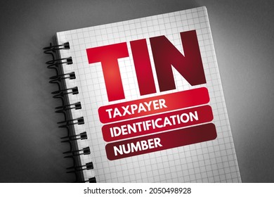 TIN - Taxpayer Identification Number is an identification number used by the Internal Revenue Service in the administration of tax laws, acronym text concept on notepad - Shutterstock ID 2050498928