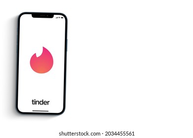 Tinder app on smartphone screen on white background. Rio de Janeiro, RJ, Brazil. August 2021.