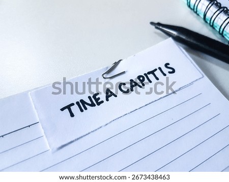 Tinea capitis writting on table background.