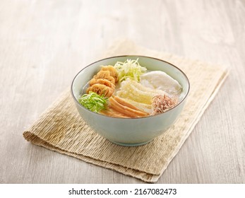 Ting Zai Style Congee served in a dish isolated on mat side view on grey background