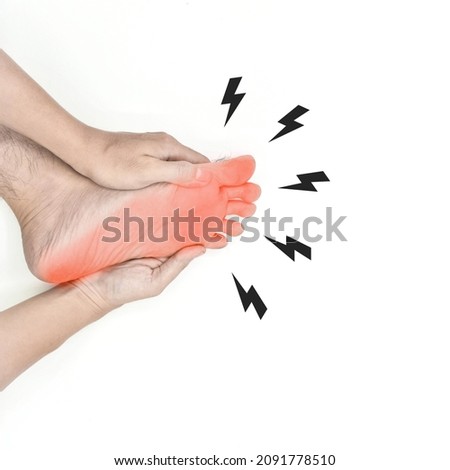 Tingling and burning sensation in foot of Asian young man with diabetes. Sensory neuropathy problems. Foot nerves problems. Plantar fasciitis. Isolated on white. Stock photo © 