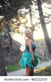 Tinker Bell. Girl Dressed As A Fairy Tale Of Peter Pan