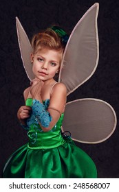 Tinker Bell.  Little Girl Dressed As A Fairy Tale Of Peter Pan